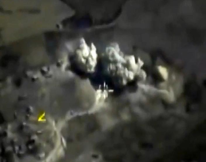 Russian Defence Ministry footage purports to show airstrikes carried out by the Russian air force on an explosives warehouse in Raqqa last month (AFP Photo/)
