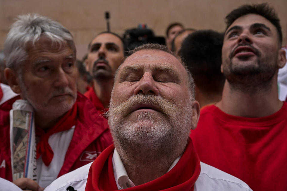 A reveller concentrates before running with La Palmosilla's fighting bulls during the first day of the running of the bulls during the San Fermin fiestas in Pamplona, Spain, Friday, July 7, 2023. (AP Photo/Alvaro Barrientos)