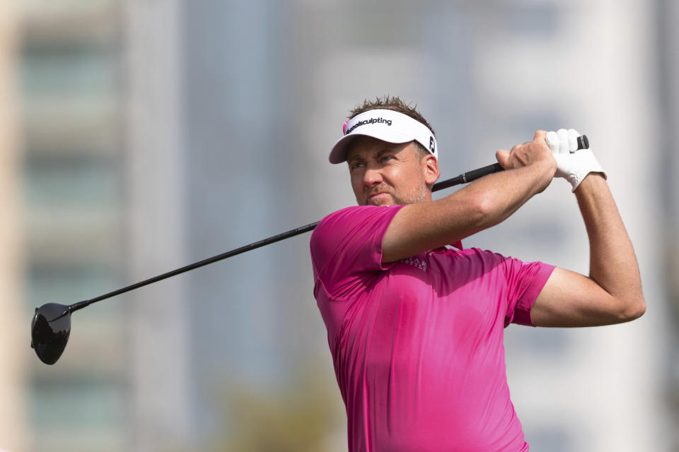 Ian Poulter of England tees off on the 8th hole during round two of the Dubai Desert Classic golf tournament in Dubai, United Arab Emirates, Friday, Jan. 25, 2019. (AP Photo/Neville Hopwood)