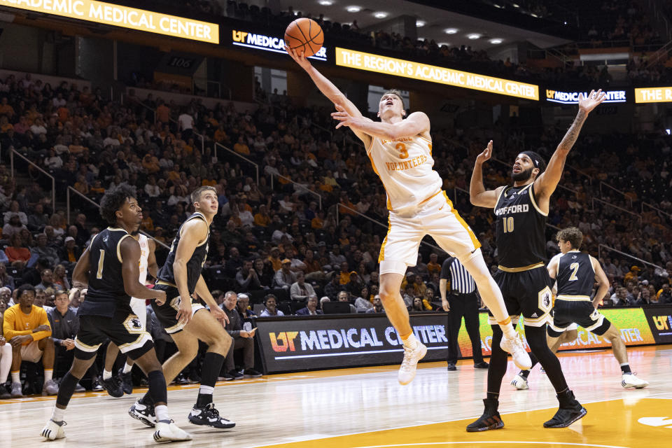 Tennessee guard Dalton Knecht (3) shoots past Wofford guard Corey Tripp (10) during the second half of an NCAA college basketball game Tuesday, Nov. 14, 2023, in Knoxville, Tenn. (AP Photo/Wade Payne)