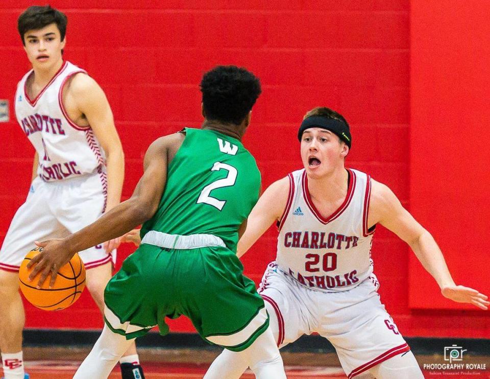 Sr. forward Kevin Kullick(20) plays aggressive defense on So. guard Chase Lowe(2) during tonight’s in-conference match up Charlotte Catholic(10-1) battles Weddington Warriors (11-0) on January 31st, 2020.