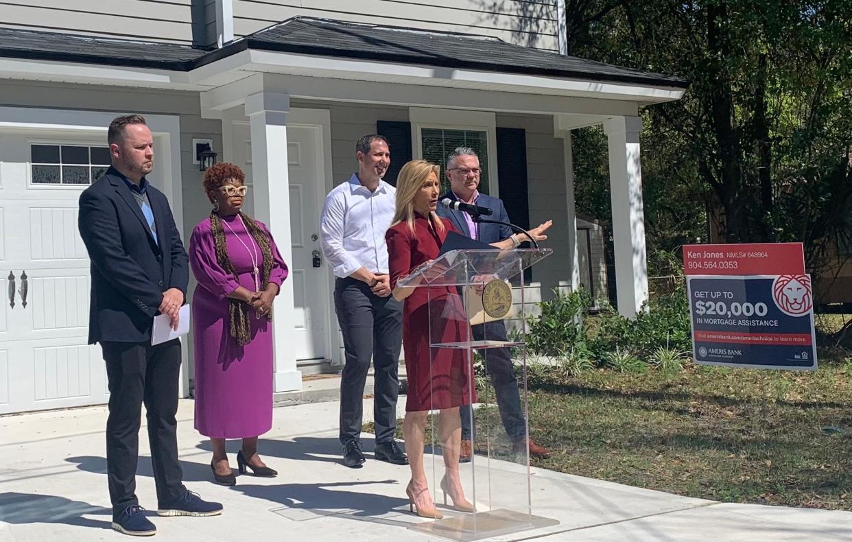 Jacksonville Mayor Donna Deegan, at podium, announces the city's down payment assistance program for home ownership. Joining her for the March 7 announcement are, from left, Joshua Hicks, the city's director of affordable housing, City Council member Ju'Coby Pittman, JWB Real Estate Companies CFO Adam Rigel, and city Housing and Community Development Division Chief Travis Jeffrey. They gathered in front of a house for sale in the 1400 block of 25th Street East.