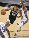 San Antonio Spurs' Rudy Gay (22) drives against Sacramento Kings' Maurice Harkless during the first half of an NBA basketball game Wednesday, March 31, 2021, in San Antonio. (AP Photo/Darren Abate)