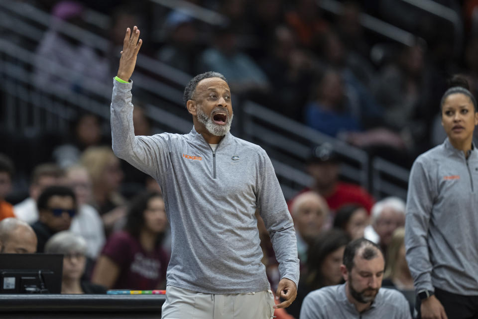 Virginia Tech head coach Kenny Brooks yells to his team during the first half of an Elite 8 college basketball game against Ohio State in the NCAA Tournament, Monday, March 27, 2023, in Seattle. (AP Photo/Stephen Brashear)