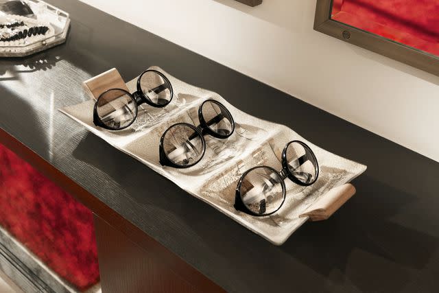 <p>Airbnb</p> Edna Mode's glasses inside her house on Airbnb