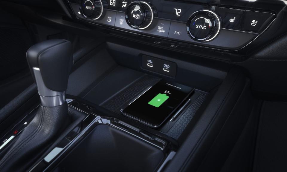 <p>High-end Touring trims come with a wireless smartphone charging pad.</p>