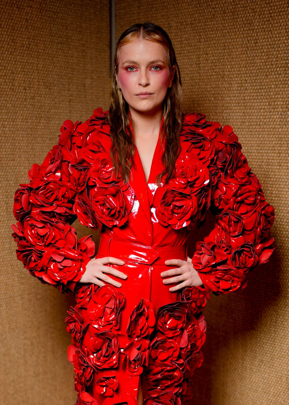 Camille Razat in a red outfit with floral details in Paris, France