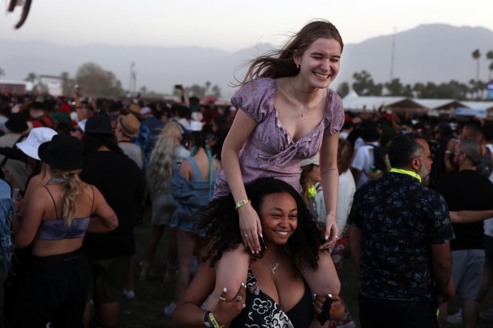 Alexandra Papavasiliou carries her friend Gabriela Pawluczuk during the Tchami performance.