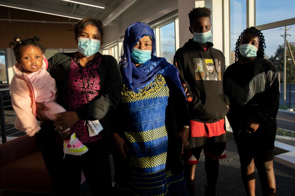 From right, Zainab Conteh, Abdul Conteh, Aminata Kamara, Maria Sankoh and Mimi Sesay, of Northland, gather at the Karl Road Branch of the Columbus Metropolitan Library on Nov. 18. Kamara, who has five grandchildren in the United States and five in Sierra Leone, is returning to the Western African country in the next few months.