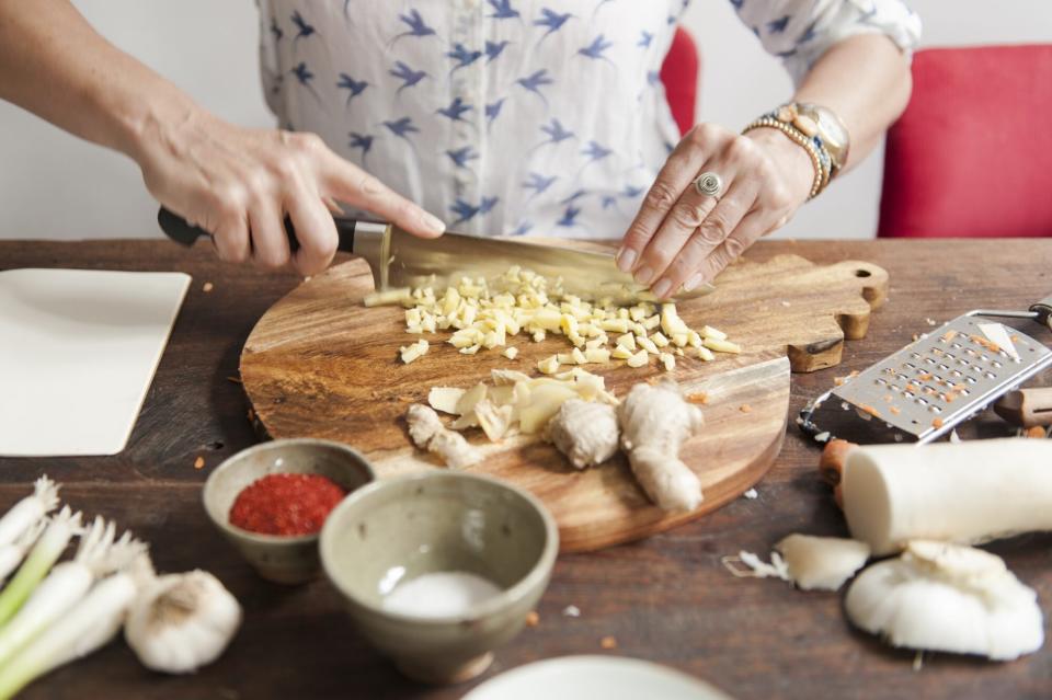 woman chopping ginger