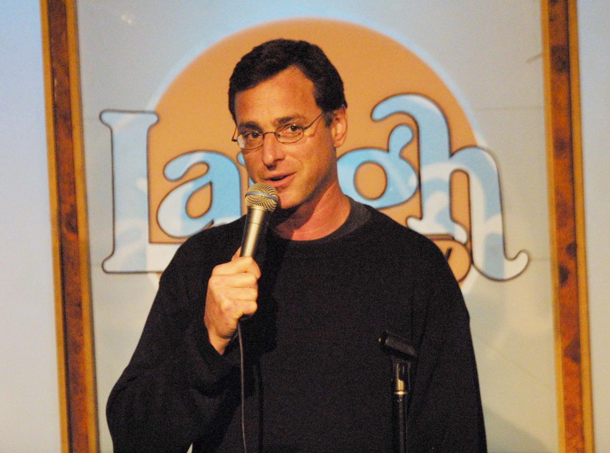 Bob Saget, beloved actor, host and stand-up comic, was found dead on Jan. 9, 2022. He was 65. Take a look back at life and career to remember America's funniest and sweetest sitcom dad. Pictured, Bob Saget performs at the "Boys Night Out" comedy benefit at The Laugh Factory hosted by talk radio host Tom Leykis on Oct. 11, 2001, in Hollywood, Calif. A portion of the proceeds will be donated to the September 11 relief efforts.