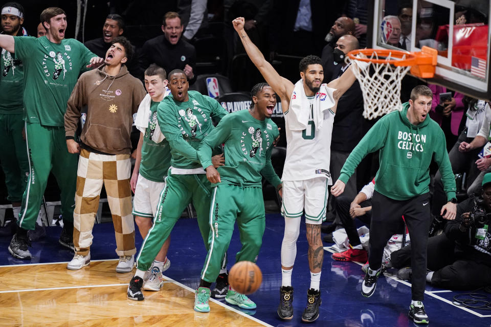 Boston Celtics forward Jayson Tatum (0) reacts as his team holds the lead during the second half of Game 4 of an NBA basketball first-round playoff series against the Brooklyn Nets, Monday, April 25, 2022, in New York. (AP Photo/John Minchillo)