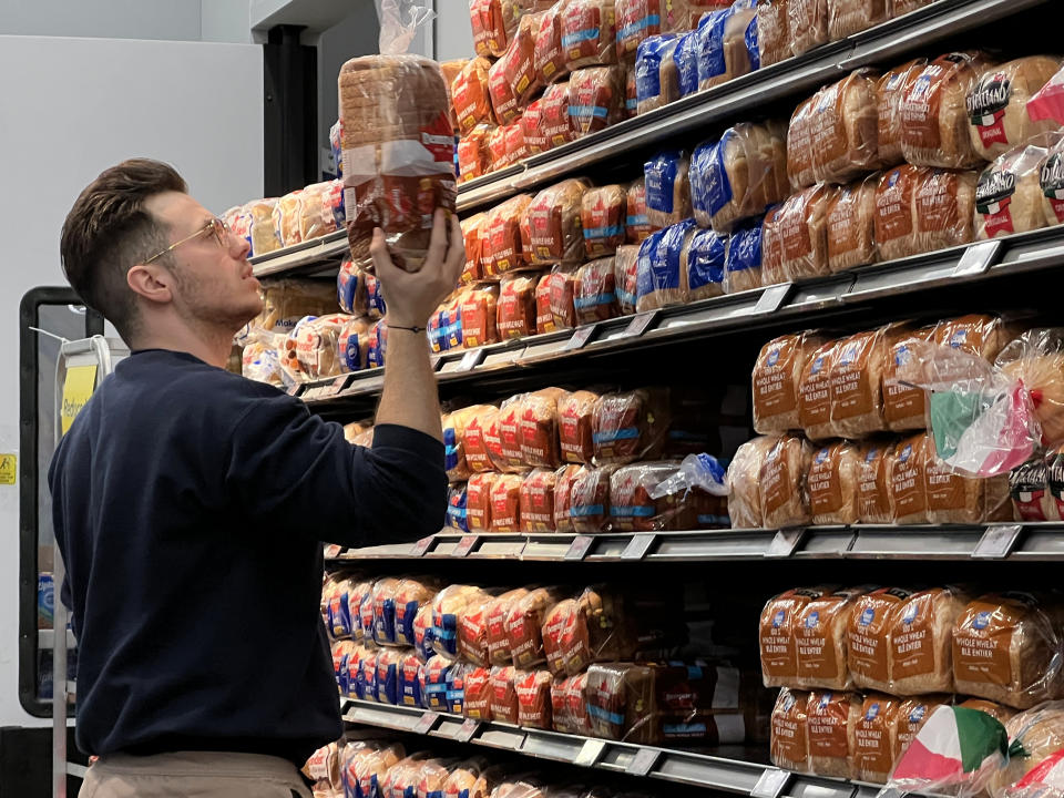 Man reads the ingredients on the package of a loaf of bread at a grocery store in Toronto, Ontario, Canada on March 11, 2023. Inflation and high grocery prices continue to plague Canadians. (Photo by Creative Touch Imaging Ltd./NurPhoto via Getty Images)