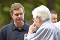 Kentucky Gov. Andy Beshear, left, speaks with Rep. Hal Rogers, R-Ky., during a presentation at Perry County Park in Hazard, Ky., Tuesday, Sept. 6, 2022. Despite being a Democratic governor in a Republican dominated state, Beshear has a large amount of support from Kentucky residents. (AP Photo/Timothy D. Easley)