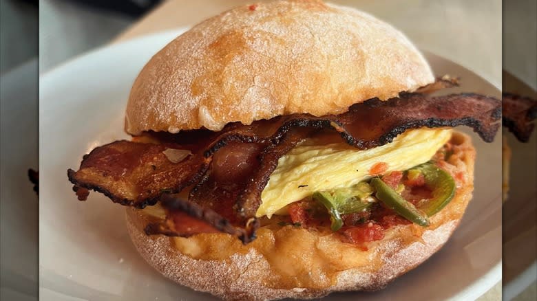 Bacon and egg breakfast sandwich on a hard roll