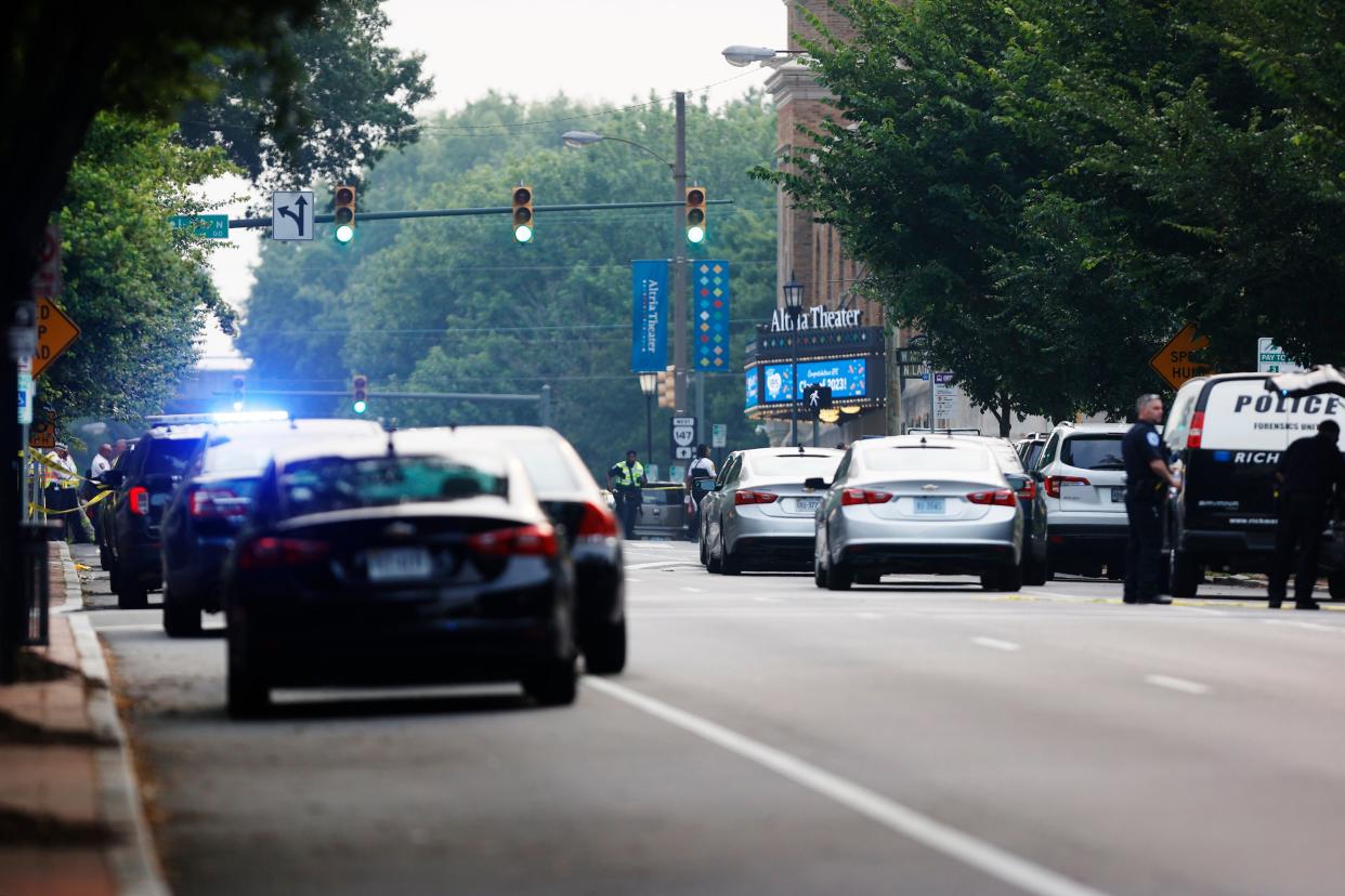 Police cars race to the scene (Mike Kropf/Richmond Times-Dispatch/AP)