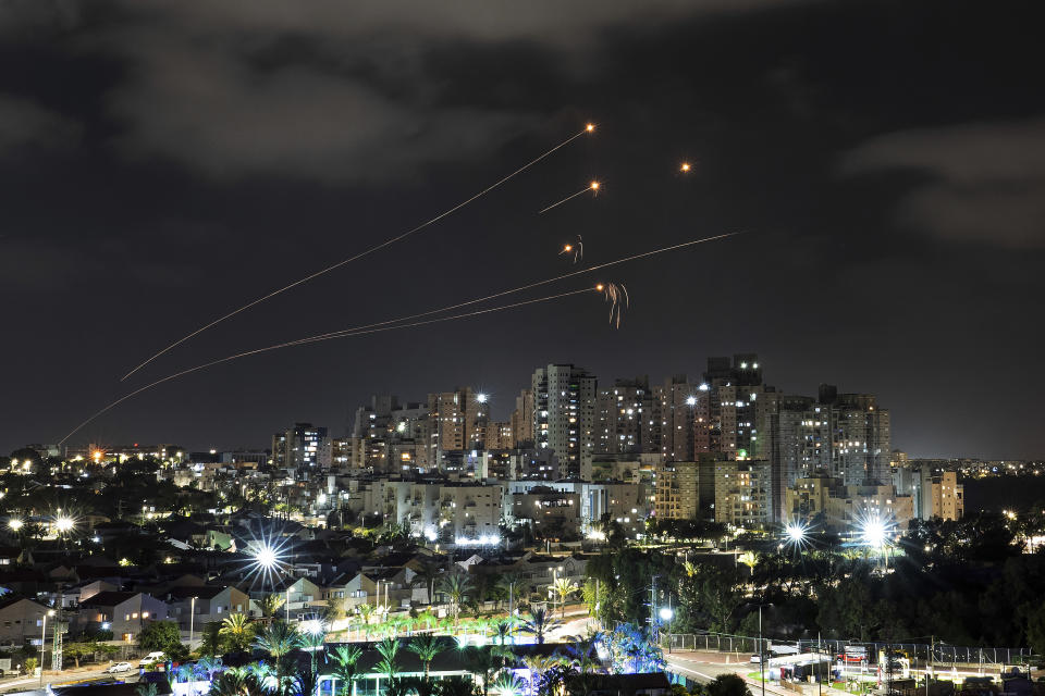 Israel's Iron Dome missile defense system fires interceptors at rockets launched from the Gaza Strip, in Ashkelon, southern Israel. Saturday, May 13, 2023. (AP Photo/Tsafrir Abayov)