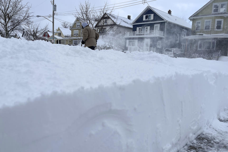 Martin Haslinger clears snow from the front of his home