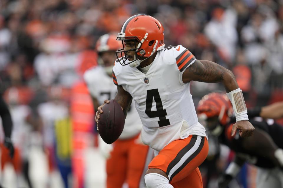 Cleveland Browns quarterback Deshaun Watson (4) runs during the first half of an NFL football game against the Cincinnati Bengals, Sunday, Dec. 11, 2022, in Cincinnati. (AP Photo/Jeff Dean)