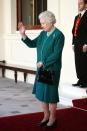 <p>To wave farewell to the King of Saudi Arabia The Queen wore a more demure coloured bottle green. [Photo: Getty] </p>