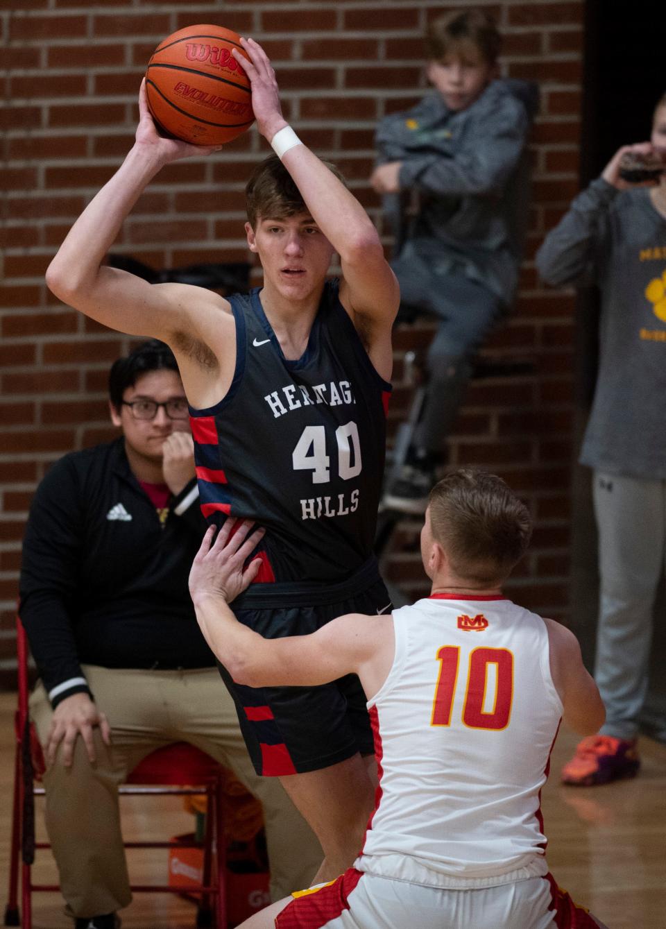 Heritage Hills’ Trent Sisley (40) passes as the Mater Dei Wildcats play the Heritage Hills Patriots Friday, Jan. 27, 2023. 