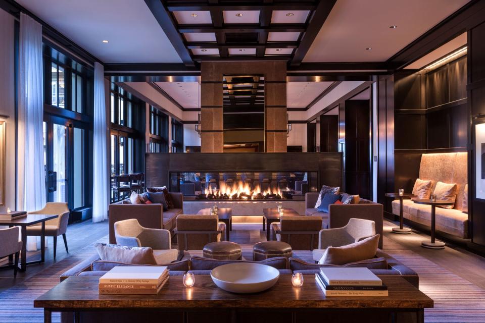 Hotel lobby lounge with fireplace at Four Seasons Vail