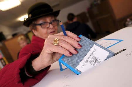 A woman casts her vote for Veneto's autonomy referendum at a polling station in Venice, Italy, October 22, 2017. REUTERS/Manuel Silvestri