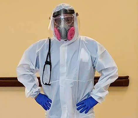 Dr. Araujo-Preza prepared for work in the Covid-19 unit. (Courtesy of Paige King)