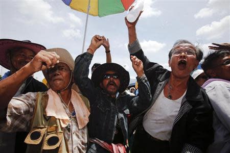 Rubber farmers shout slogans at their gathering place during protests in Surat Thani September 4, 2013. REUTERS/Athit Perawongmetha