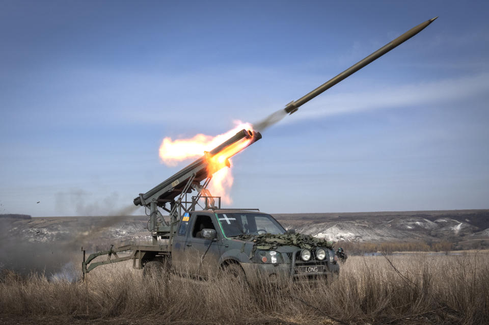 A multiple launch rocket system based on a pickup truck fires towards Russian positions at the front line, near Bakhmut, Donetsk region, Ukraine, Tuesday, March 5, 2024. (AP Photo/Efrem Lukatsky)