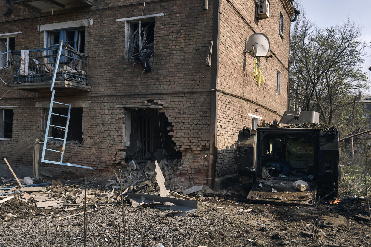 A damaged APC seen in Bakhmut, the site of heavy battles with Russian troops in the Donetsk region, Ukraine, Sunday, April 9, 2023. (AP Photo/Libkos)