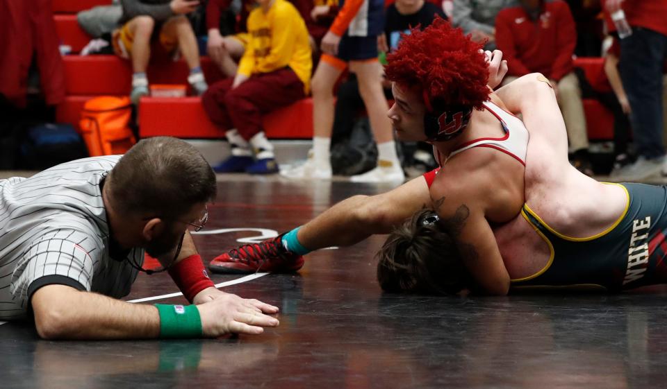 Faith Christian’s Zachary White and Lafayette Jeff’s Durya Minor compete in the 160 lbs championship during the IHSAA wrestling sectional championship, Saturday, Jan. 28, 2023, at Lafayette Jeff High School in Lafayette, Ind.