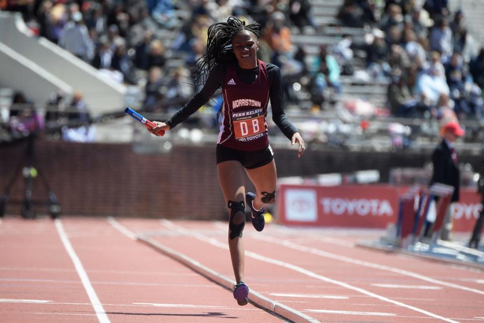 Morristown's Aaliyah Murphy crosses the finish line in a 4x400 relay Thursday, April 28, 2022 at the Penn Relays in Philadelphia, Pa. Morristown placed first in the event.