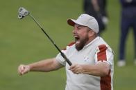 Team Europe's Shane Lowry celebrates on the 18th hole after makes a putt and winning their four-ball match the Ryder Cup at the Whistling Straits Golf Course Saturday, Sept. 25, 2021, in Sheboygan, Wis. (AP Photo/Charlie Neibergall)