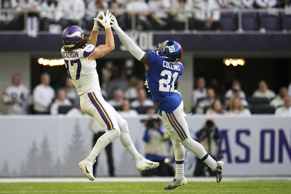 New York Giants safety Landon Collins (21) breaks up a pass intended for Minnesota Vikings tight end T.J. Hockenson (87) during the first half of an NFL football game, Saturday, Dec. 24, 2022, in Minneapolis. (AP Photo/Abbie Parr)