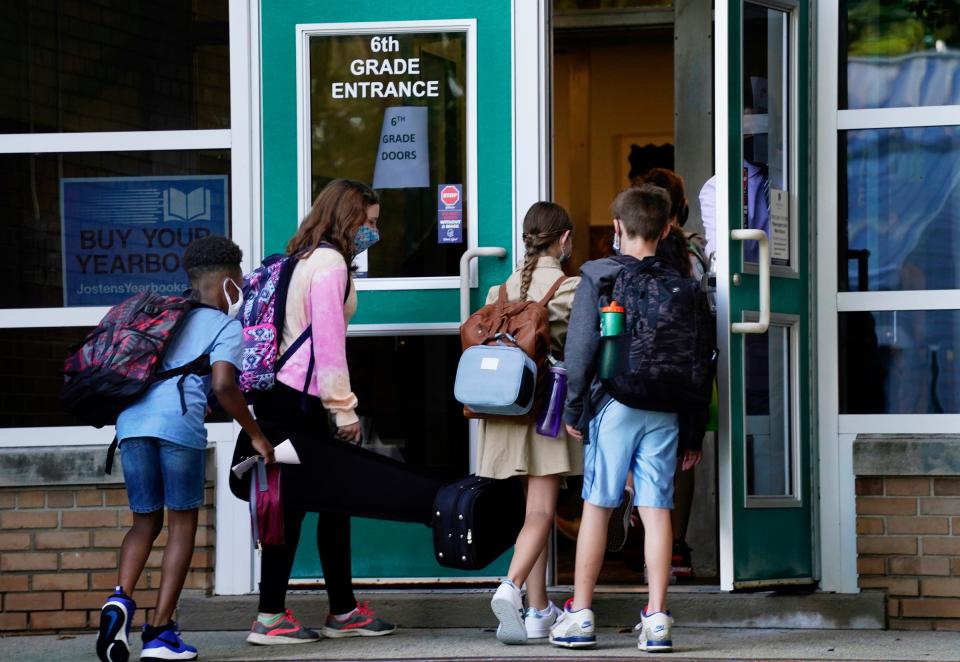 Students make their way to the first day of school at Anderson Middle School in Berkley Monday, Aug. 30, 2021.