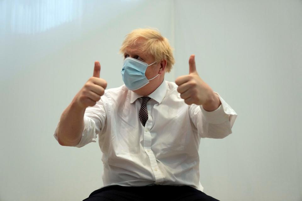 Britain's Prime Minister Boris Johnson gives a thumbs up after receiving his second jab of the Oxford/AstraZeneca Covid-19 vaccine  at the Francis Crick Institute in central London on June 3, 2021. (Photo by Matt Dunham / POOL / AFP) (Photo by MATT DUNHAM/POOL/AFP via Getty Images)