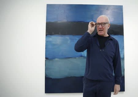 Artist Sean Scully posees with his work "Landline Blue Blue" at the Timothy Taylor Gallery in London November 20, 2014. REUTERS/Luke MacGregor