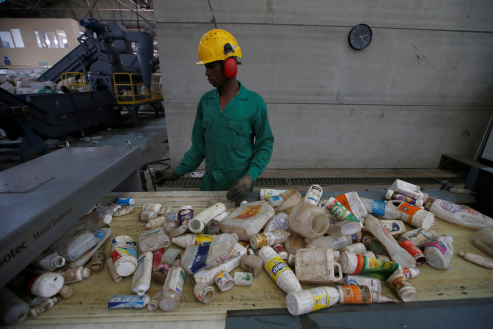 An employee sorts plastic waste before being processed at a plastic recycling factory in Nairobi, Kenya. (Photo: Baz Ratner / Reuters)