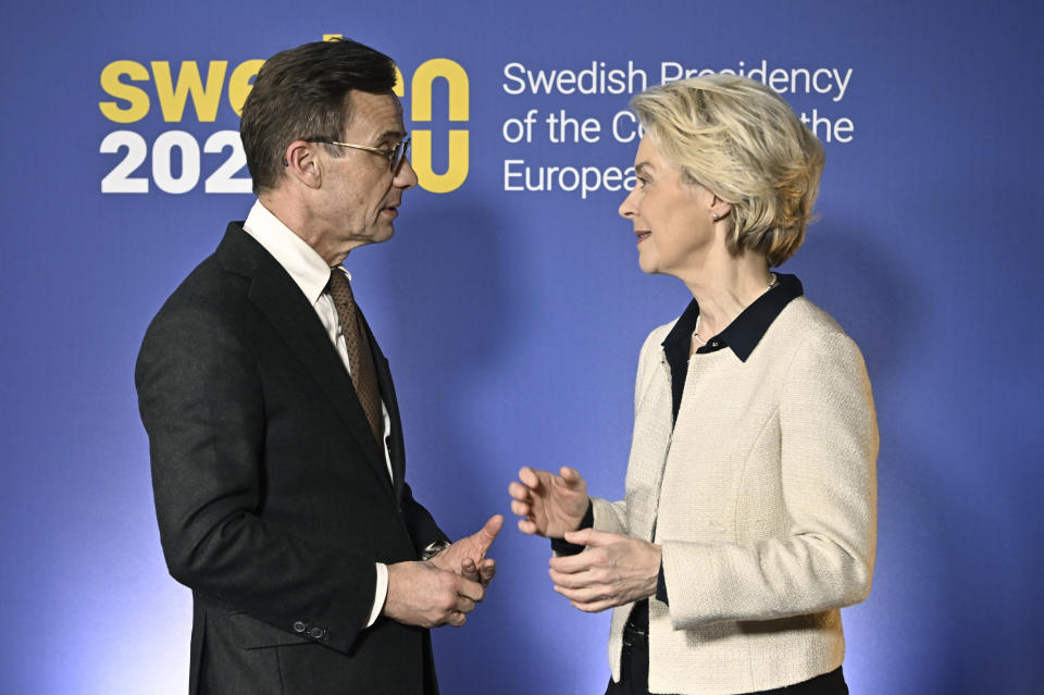 Sweden's Prime Minister Ulf Kristersson, left and EU Commission President Ursula von der Leyen, speak as they arrive for a dinner at the Ice Hotel in Jukkasjarvi, Sweden, Thursday, Jan. 12, 2023. (Jonas Ekstromer/TT News Agency via AP)