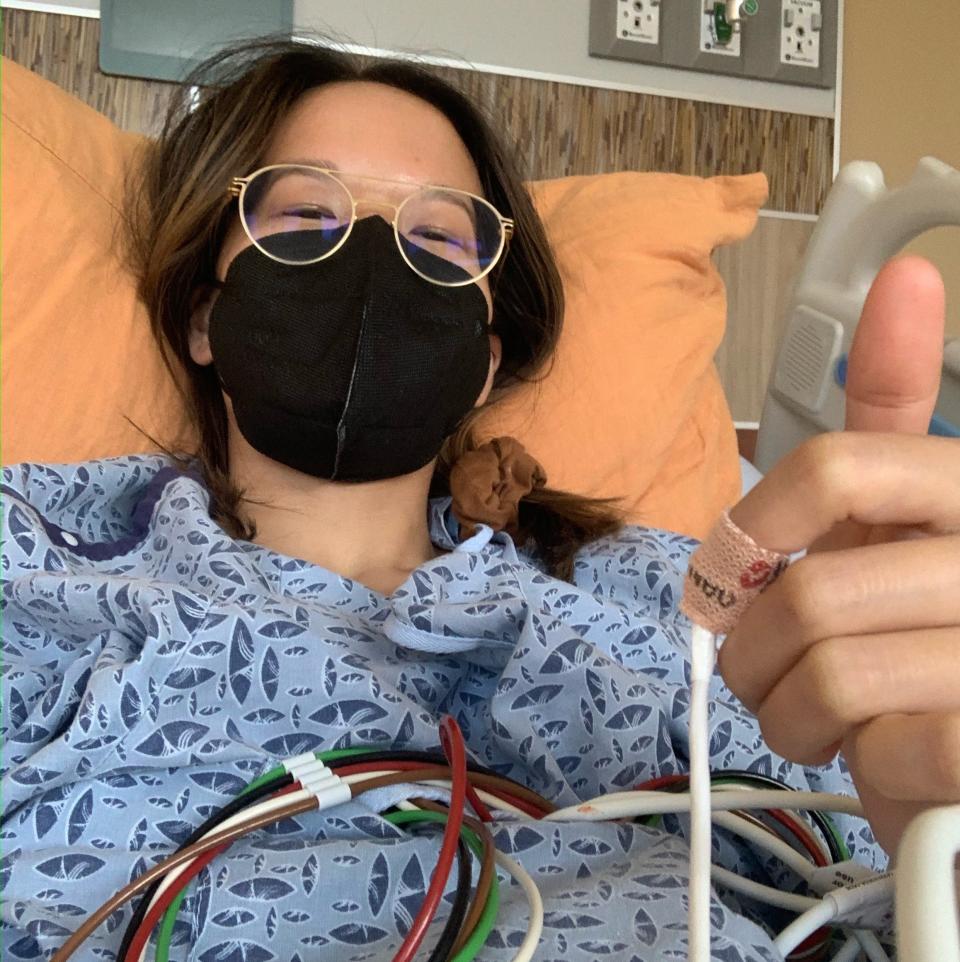 Desiree Chan gives a thumbs up from her hospital bed