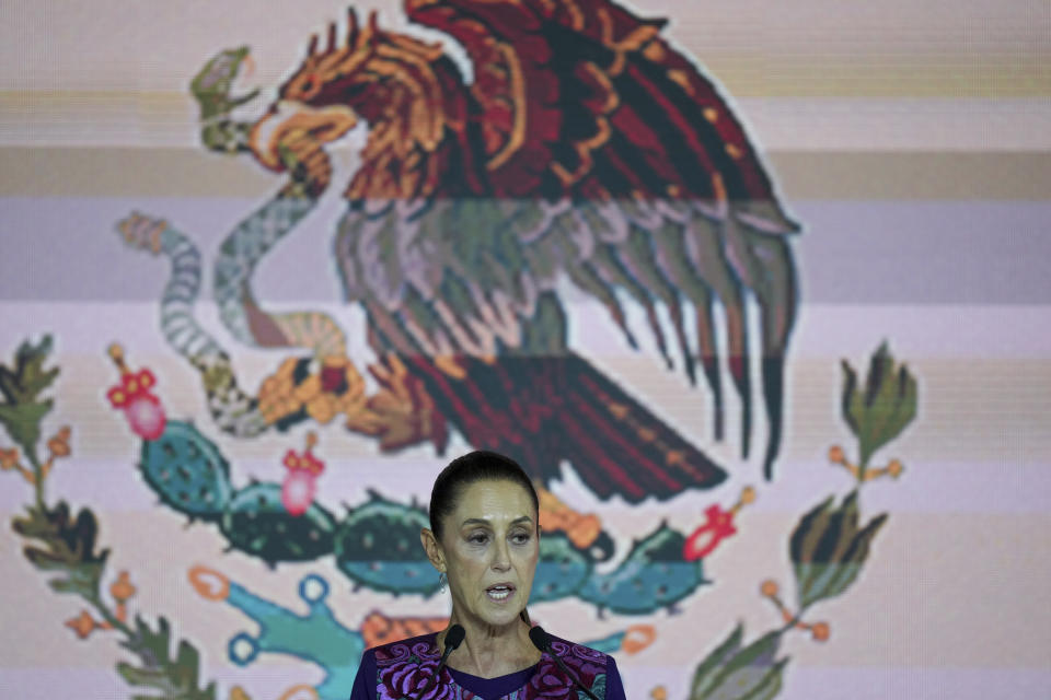 Ruling party presidential candidate Claudia Sheinbaum addresses supporters after the National Electoral Institute announced she held an irreversible lead in the election in Mexico City, early Monday, June 3, 2024. (AP Photo/Fernando Llano)