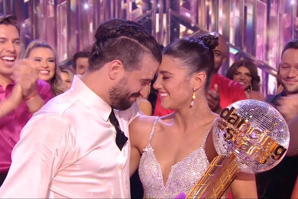 Mark Ballas and Charli D'Amelio are besides themselves as they wins Dancing with the Stars finale (Disney+)