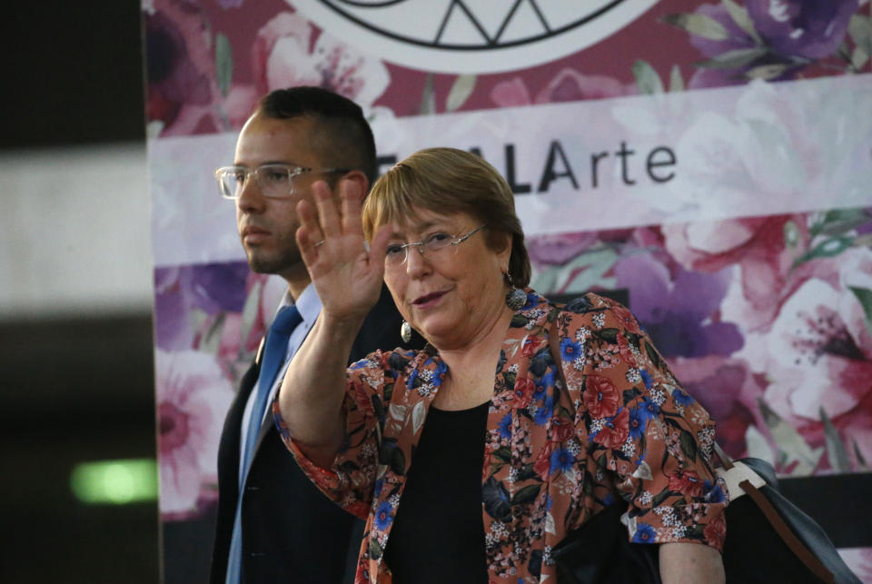 U.N. High Commissioner for Human Rights Michelle Bachelet waves as she exits the Simon Bolivar International Airport in Maiquetia, Venezuela, Wednesday, June 19, 2019. On her first visit to the South American country, Bachelet is expected to meet with Venezuelan President Nicolas Maduro and opposition leader Juan Guaidó — two men locked in a power struggle for control of the crisis-wracked nation. (AP Photo/Ariana Cubillos)