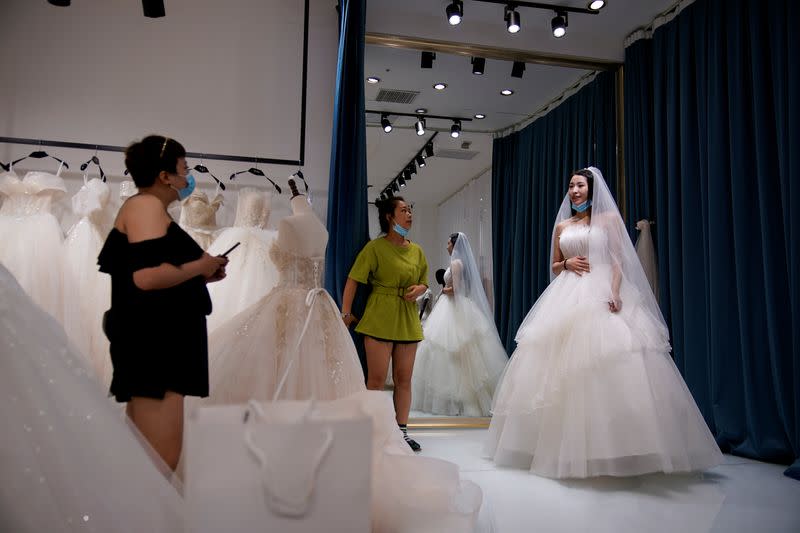 The Wider Image: Coronavirus dampens celebrations in China's wedding gown city