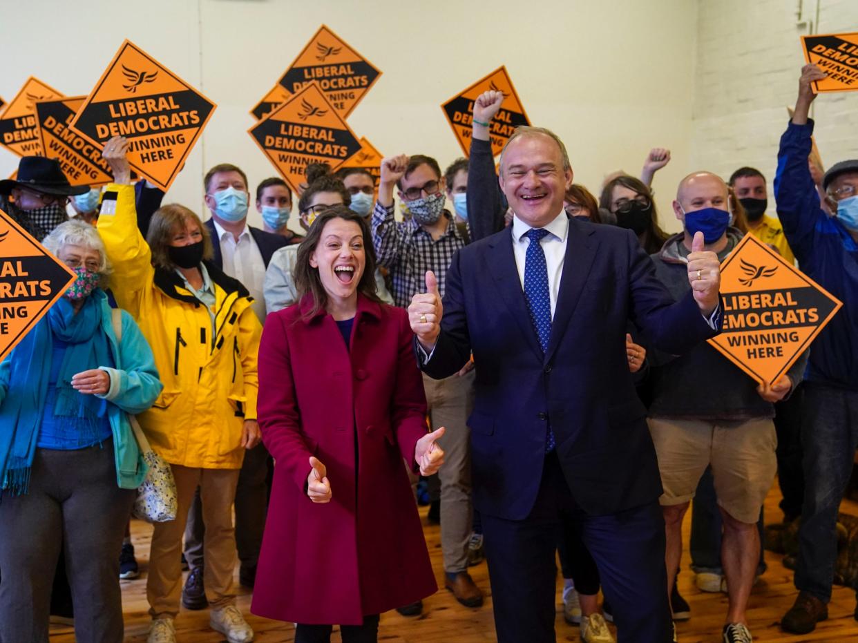 Liberal Democrat leader Ed Davey and Sarah Green, the party’s new MP for Chesham and Amersham, celebrate her by-election victory on Friday (PA)