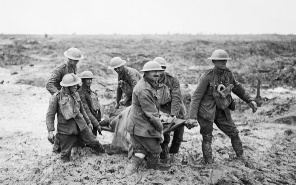 A team of stretcher bearers struggle through deep mud to carry a wounded man to safety near Boesinghe on 1 August 1917 during the Third Battle of Ypres / Battle of Pilckem Ridge, 1 August 1917 (First World War / WWI) Photo: John Warwick Brooke Source: http://media.iwm.org.uk/iwm/mediaLib//358/media-358346/large.jpg This is photograph Q 5935 from the collections of the Imperial War Museums. - John Warwick Brooke/John Warwick Brooke