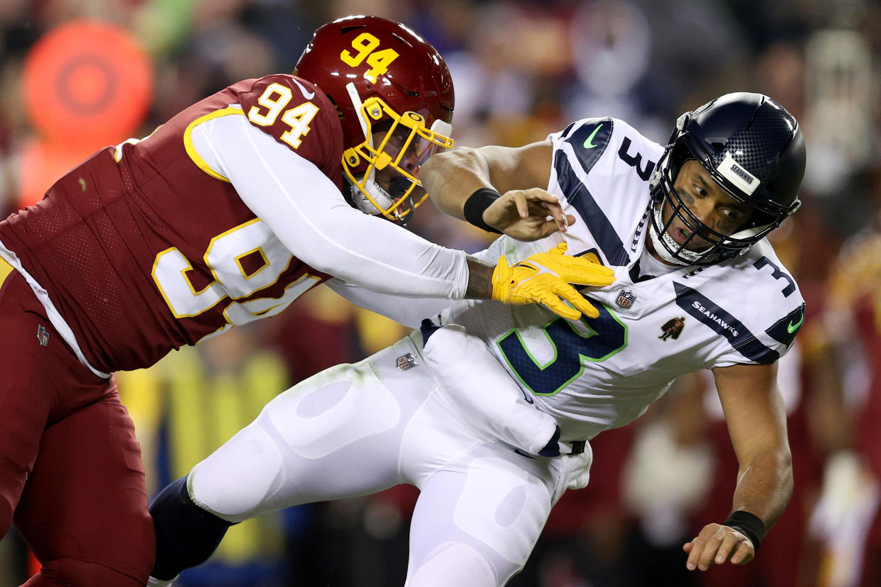 Daron Payne of the Washington Football Team sacks Russell Wilson on Monday night. (Photo by Patrick Smith/Getty Images)