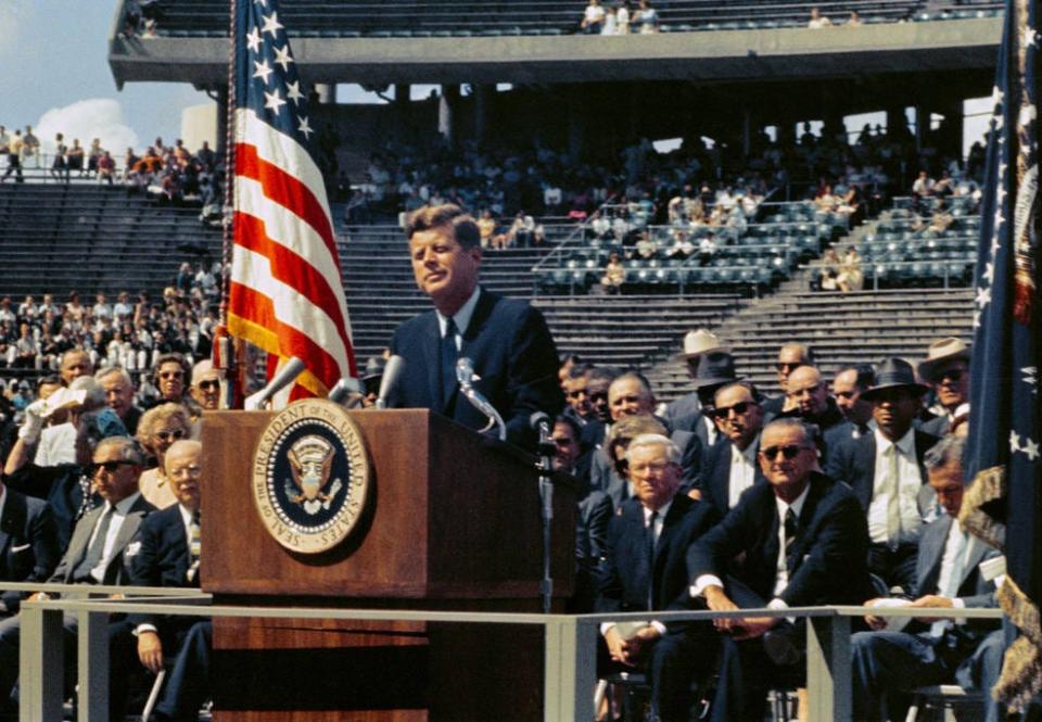 President John F. Kennedy addressing a crowd at Rice University’s stadium in Houston reaffirming his support for America’s space program including landing a man on the Moon.