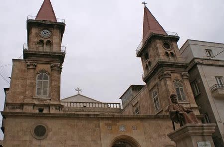 The Statue of Bishop Germanos Farhat is pictured in front of a church in the Old City of Aleppo, Syria December 12, 2009. REUTERS/Khalil Ashawi/Files